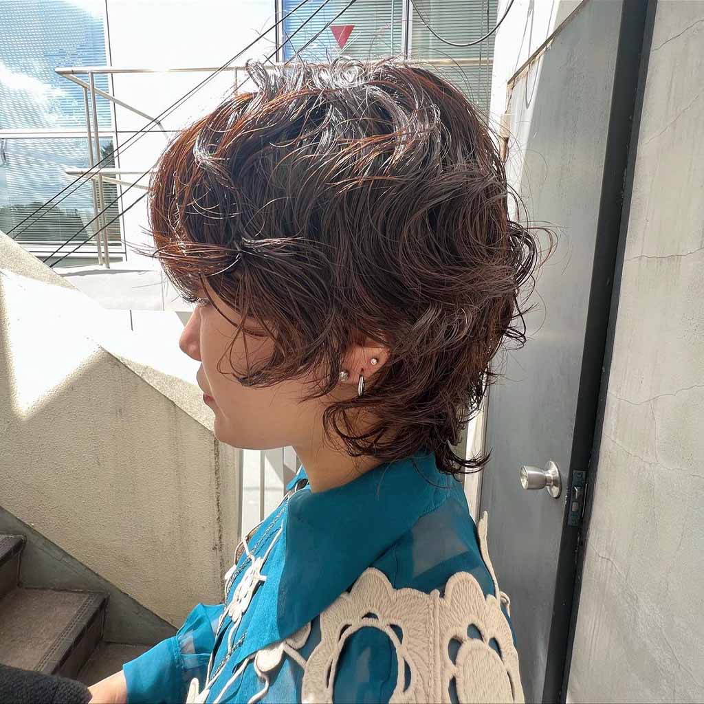 A girl with a bob cut on permed hair cut