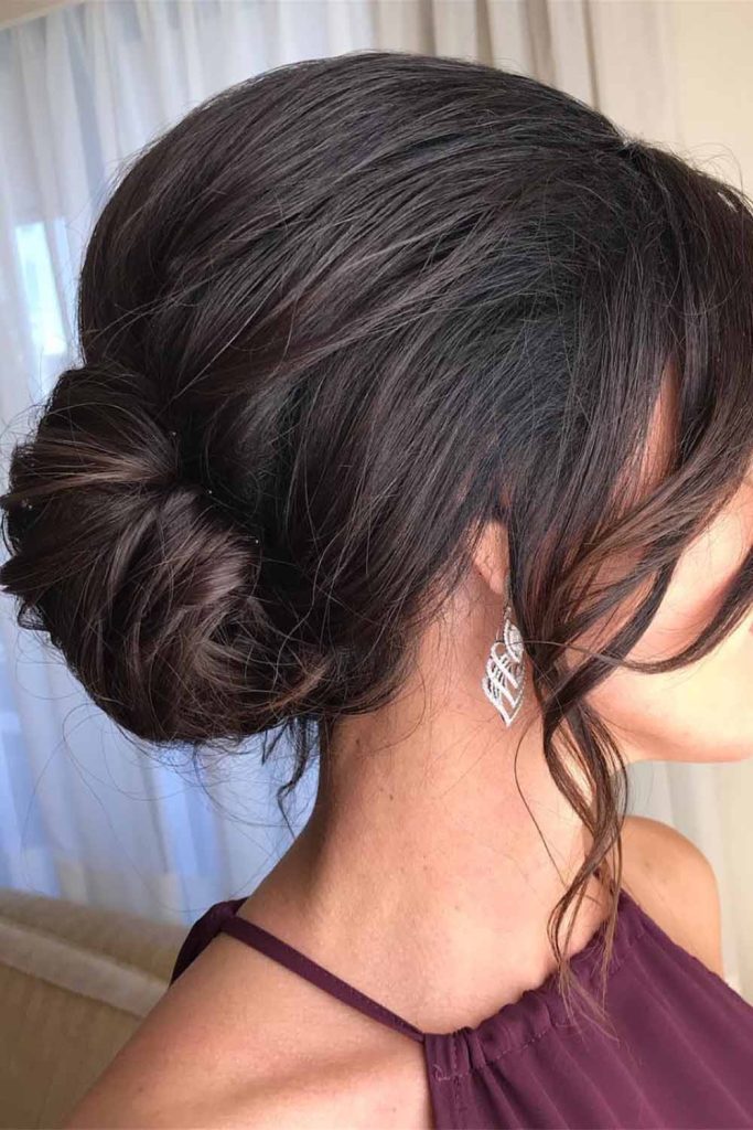 Sleek Side Bun with Loose Tendrils